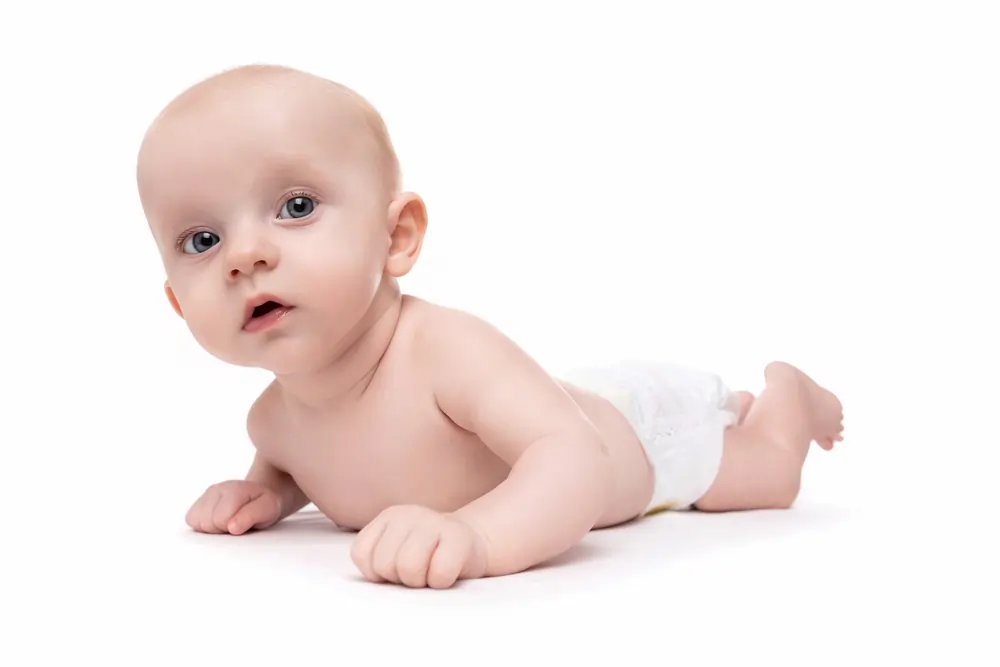newborn baby in diapers on a white isolated backgr width 1000.format webp